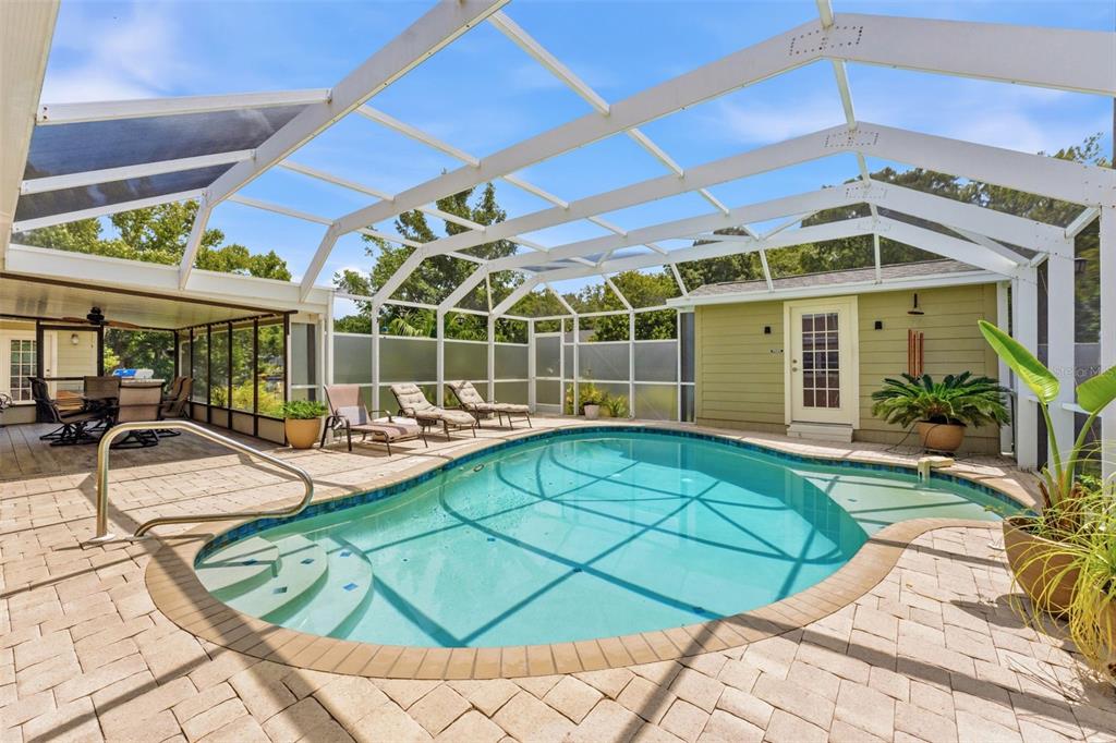 A grassy lawn overlooks a calm canal lined with trees and waterfront homes — 6355 SEBRING STREET, WEEKI WACHEE, FL