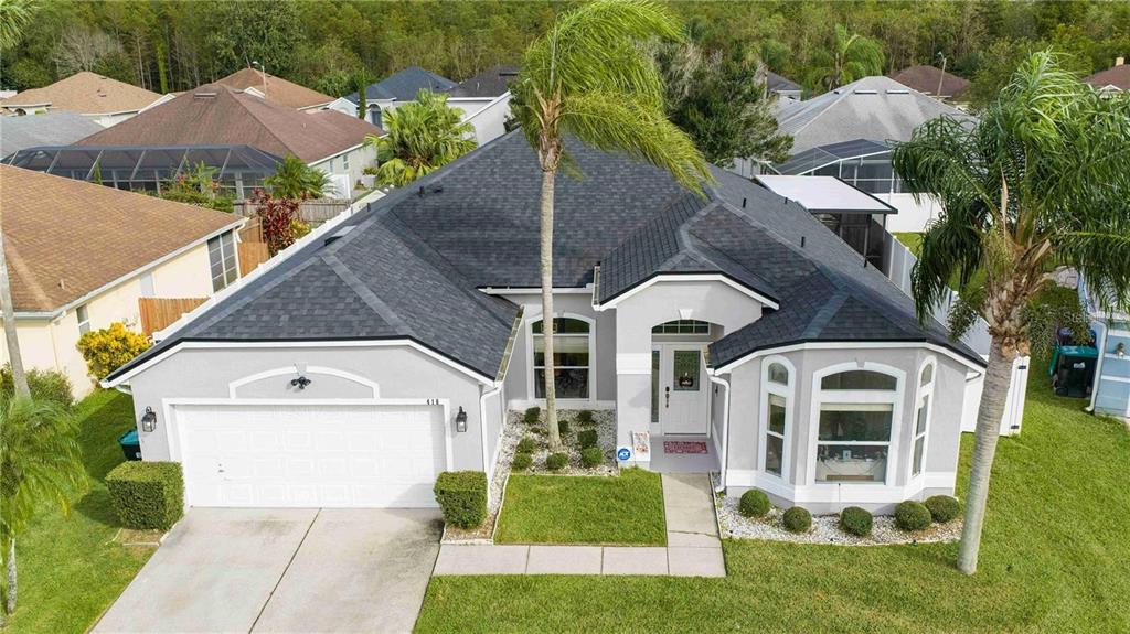 An aerial view of a single-story gray house with a dark shingled roof and palm trees — 416 BECKY STREET, ORLANDO, FL