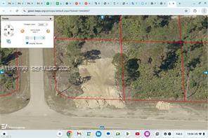 An aerial map view shows a cleared, rectangular vacant lot bordered by red property lines — 946 columbus blvd, Lehigh Acres FL 33974, LEHIGH ACRES, FL