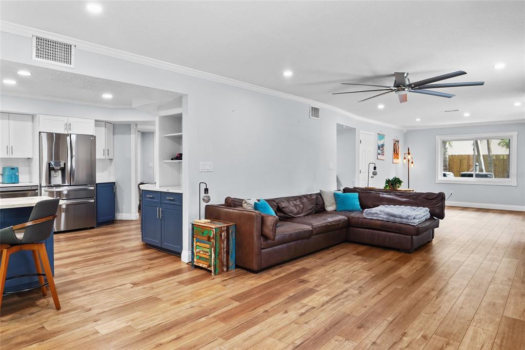 A two-story blue house with a stone facade and a paved driveway — 9545 135TH STREET, SEMINOLE, FL