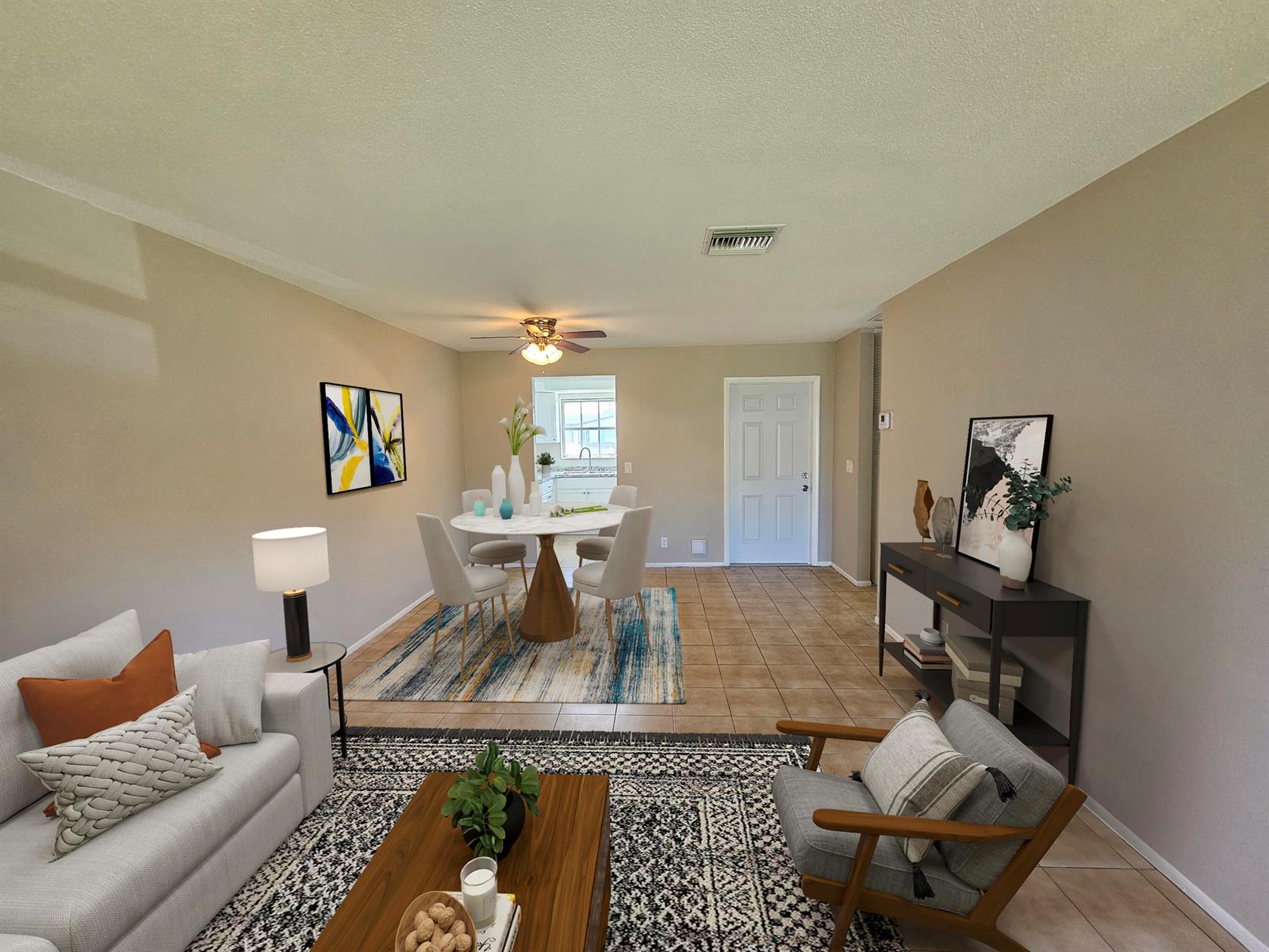 This open-concept living and dining area features tile flooring, neutral walls, and modern furniture — 2966 Ashley Drive E # F, West Palm Beach FL 33415, WEST PALM BEACH, FL