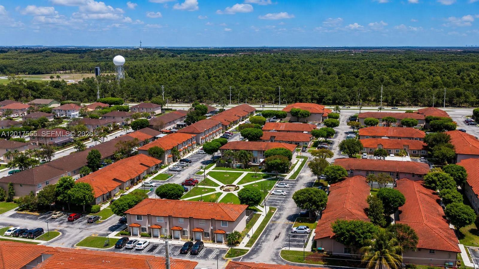 An aerial view shows a residential complex with red-tiled roofs and a central courtyard — 17184 SW 138th Ct, Miami FL 33177, MIAMI, FL