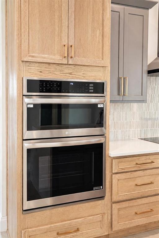 A kitchen features a built-in LG microwave and oven unit surrounded by light wood cabinetry — 68 ERIC DRIVE, PALM COAST, FL