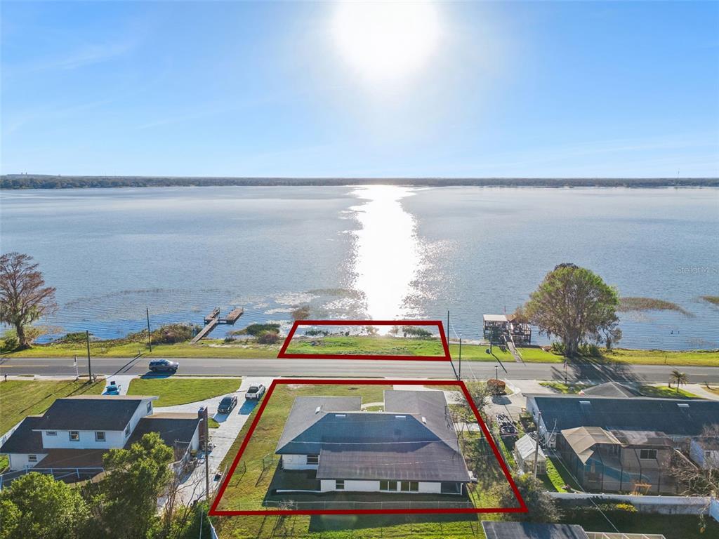 An aerial view shows a house and a separate waterfront lot across a road — 1106 LAKE ARIANA BOULEVARD, AUBURNDALE, FL