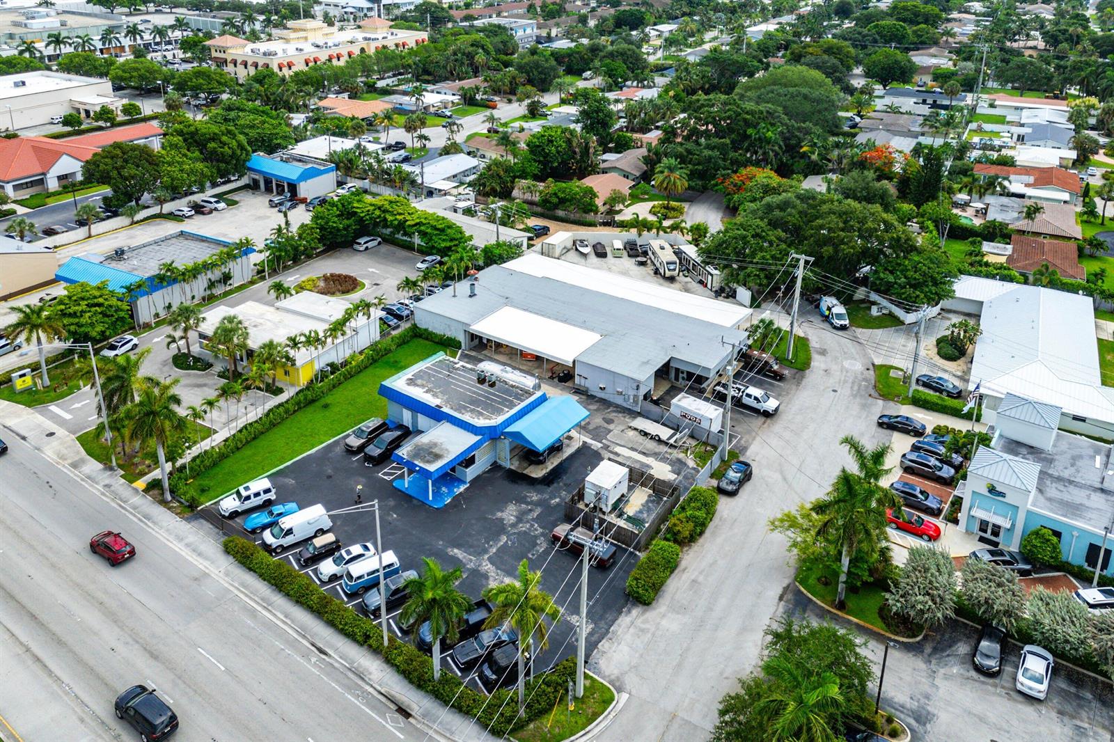 An aerial view shows a commercial building with a parking lot and surrounding neighborhood — 3400 N Federal Highway, Lighthouse Point FL 33064, LIGHTHOUSE POINT, FL