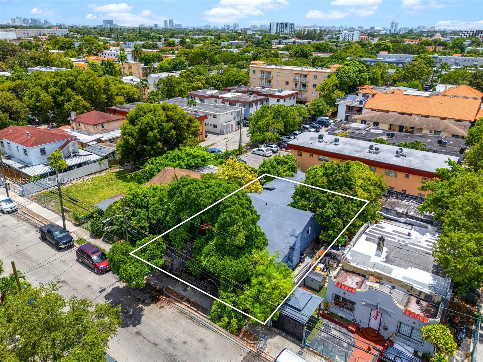 An aerial view shows a residential property outlined in white, surrounded by trees and buildings — 210 SW 13th Ave, Miami FL 33135, MIAMI, FL