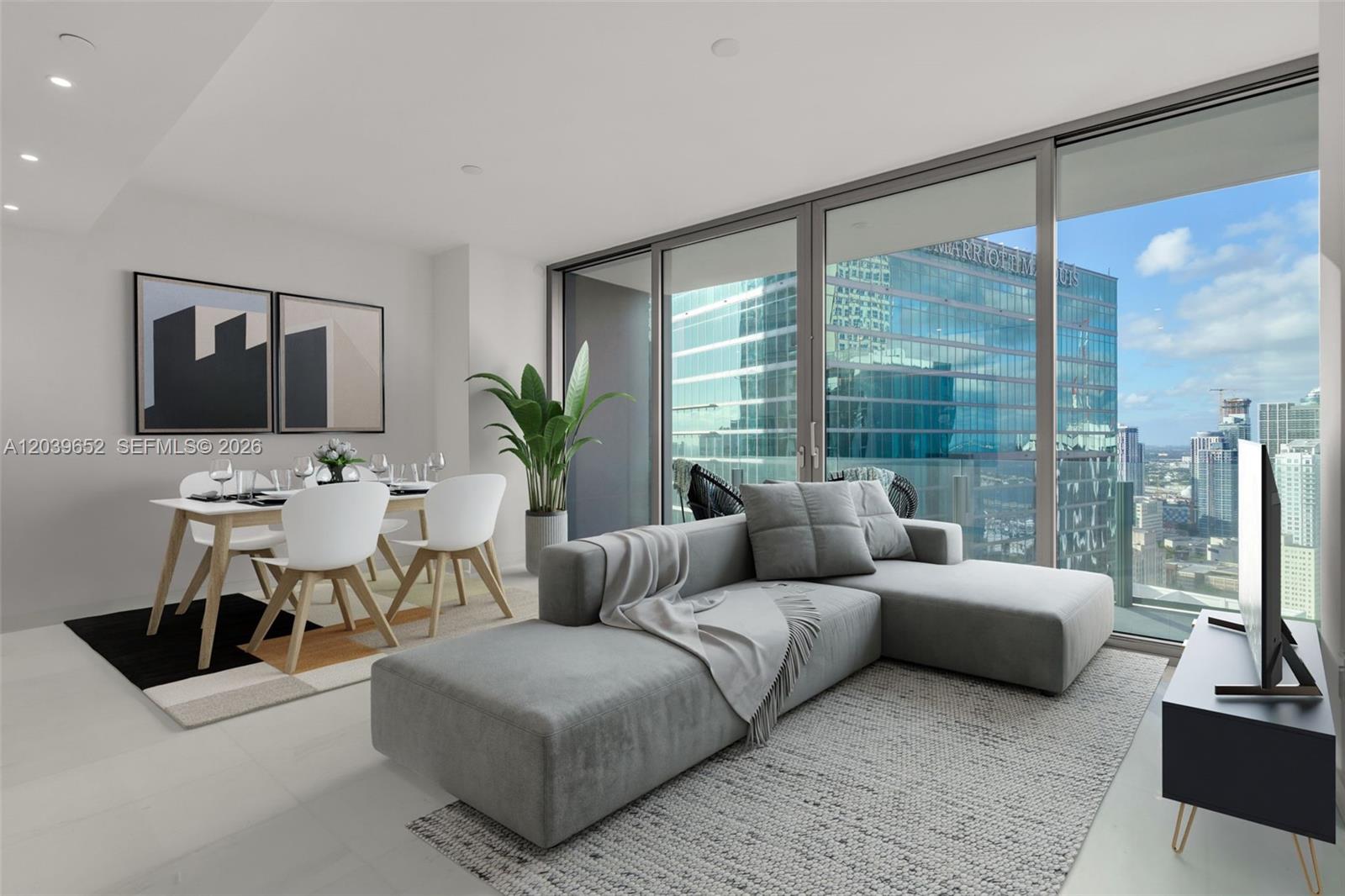 A modern living and dining area features a gray sectional sofa, dining set, and floor-to-ceiling windows — 300 Biscayne Blvd Way # 4008, Miami FL 33131, MIAMI, FL
