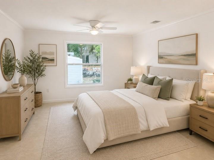 A bright bedroom features a queen bed, light wood furniture, a ceiling fan, and tile flooring — 1469 19TH STREET, SARASOTA, FL