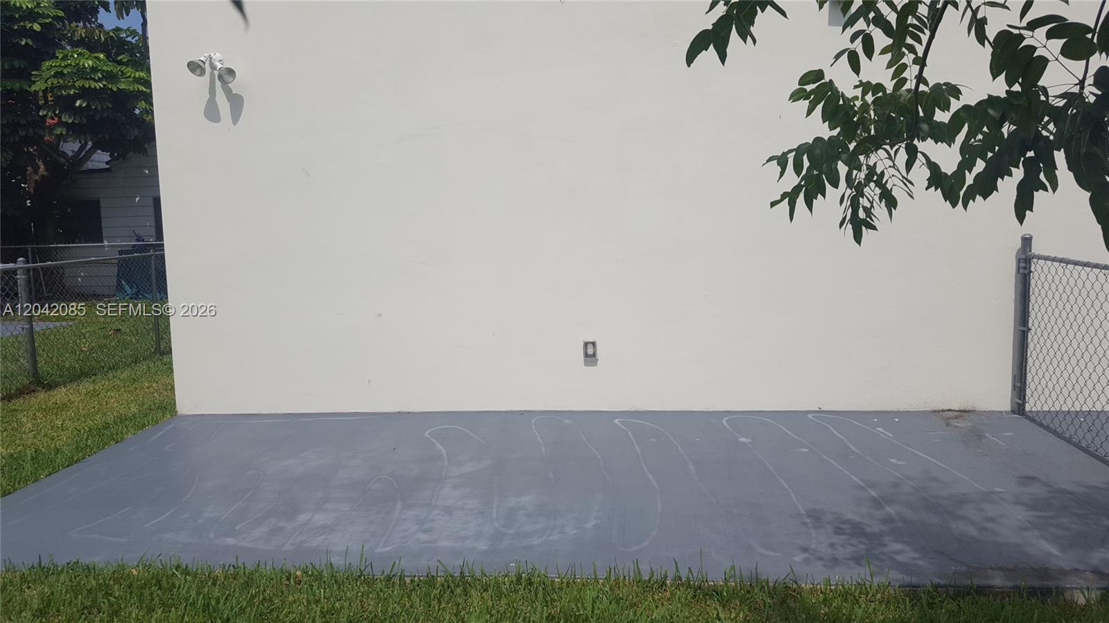 An aerial view shows a two-story duplex with a concrete driveway and two parked cars — 1029 SW 11th Ave # 0, Miami FL 33130, MIAMI, FL