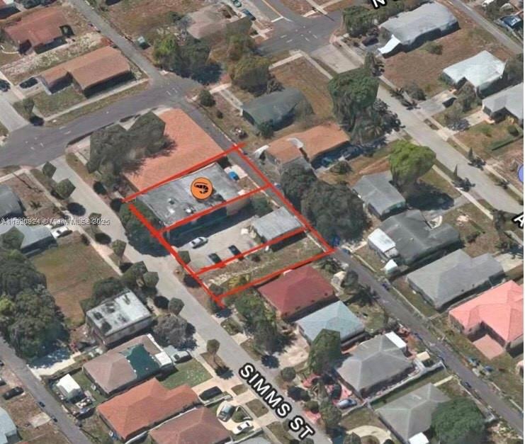 This aerial view shows a commercial building with a parking lot outlined in red — 2243 Simms St, Hollywood FL 33020, HOLLYWOOD, FL