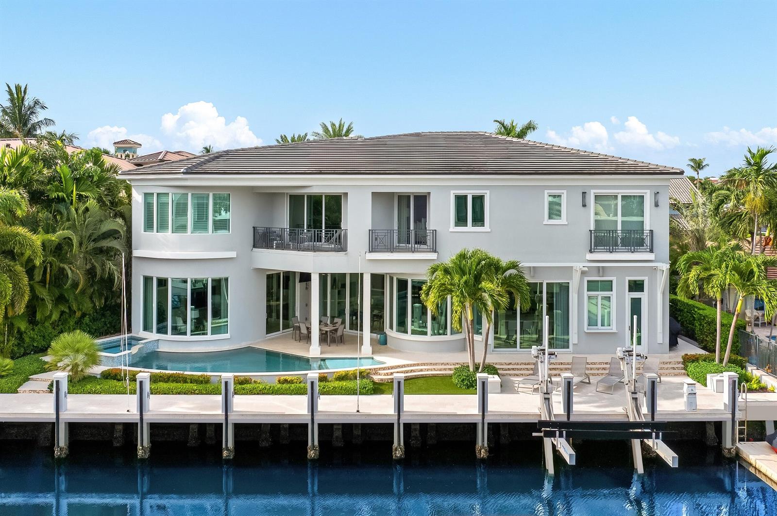 A two-story house with a pool and a private boat dock on a canal — 863 Enfield Street, Boca Raton FL 33487, BOCA RATON, FL