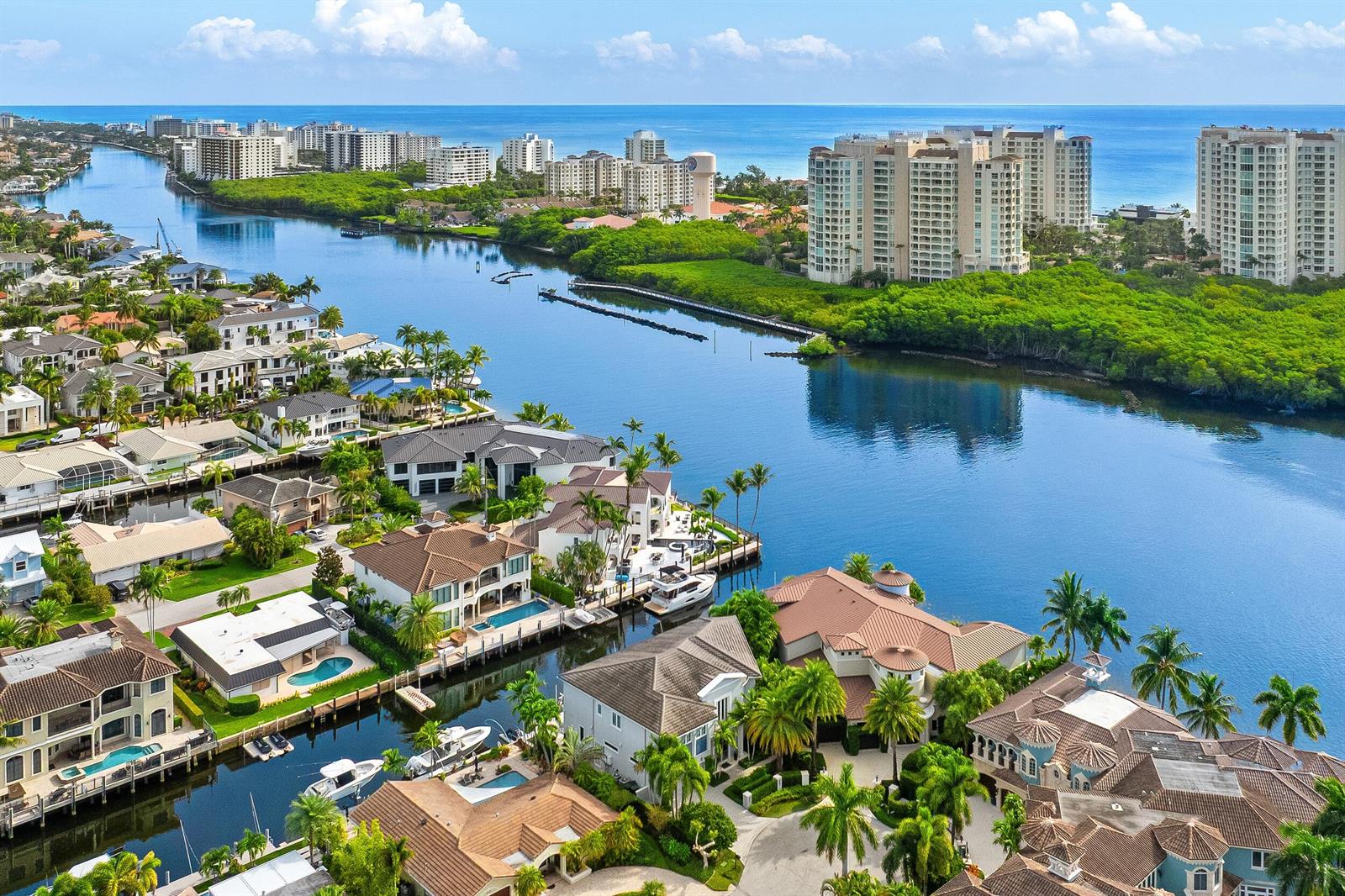 An aerial view of waterfront luxury homes along a canal leading to the ocean — 863 Enfield Street, Boca Raton FL 33487, BOCA RATON, FL