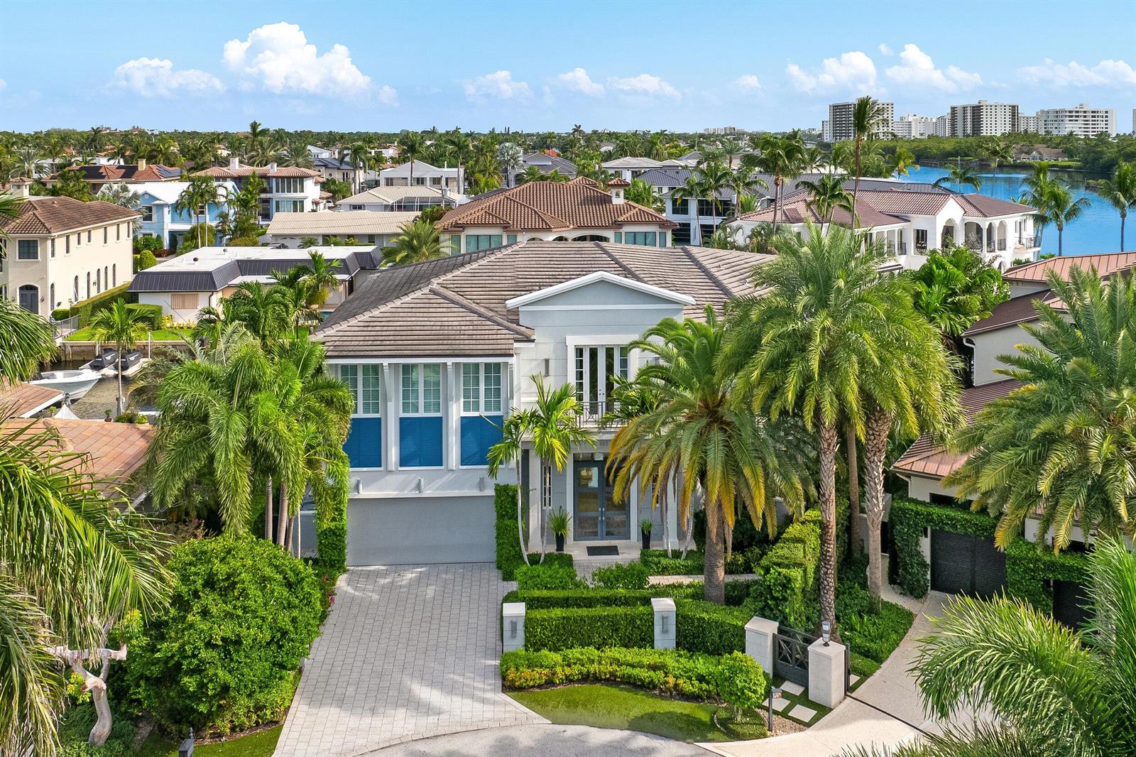 An aerial view of a two-story house with a paved driveway and palm trees — 863 Enfield Street, Boca Raton FL 33487, BOCA RATON, FL