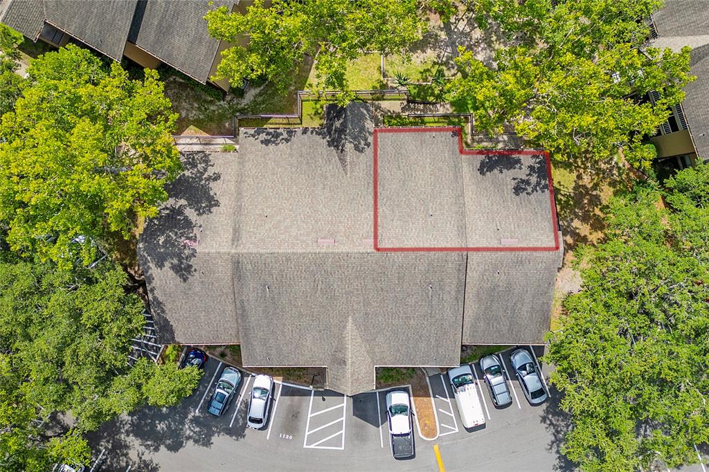 An aerial view shows a multi-unit residential building with a red outline highlighting a roof section — 627 DORY LANE UNIT 304, ALTAMONTE SPRINGS, FL