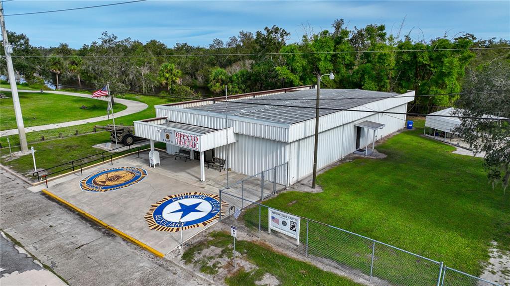 An aerial view of an American Legion building with a large parking lot and lawn — 2124 NW AMERICAN LEGION DRIVE, ARCADIA, FL