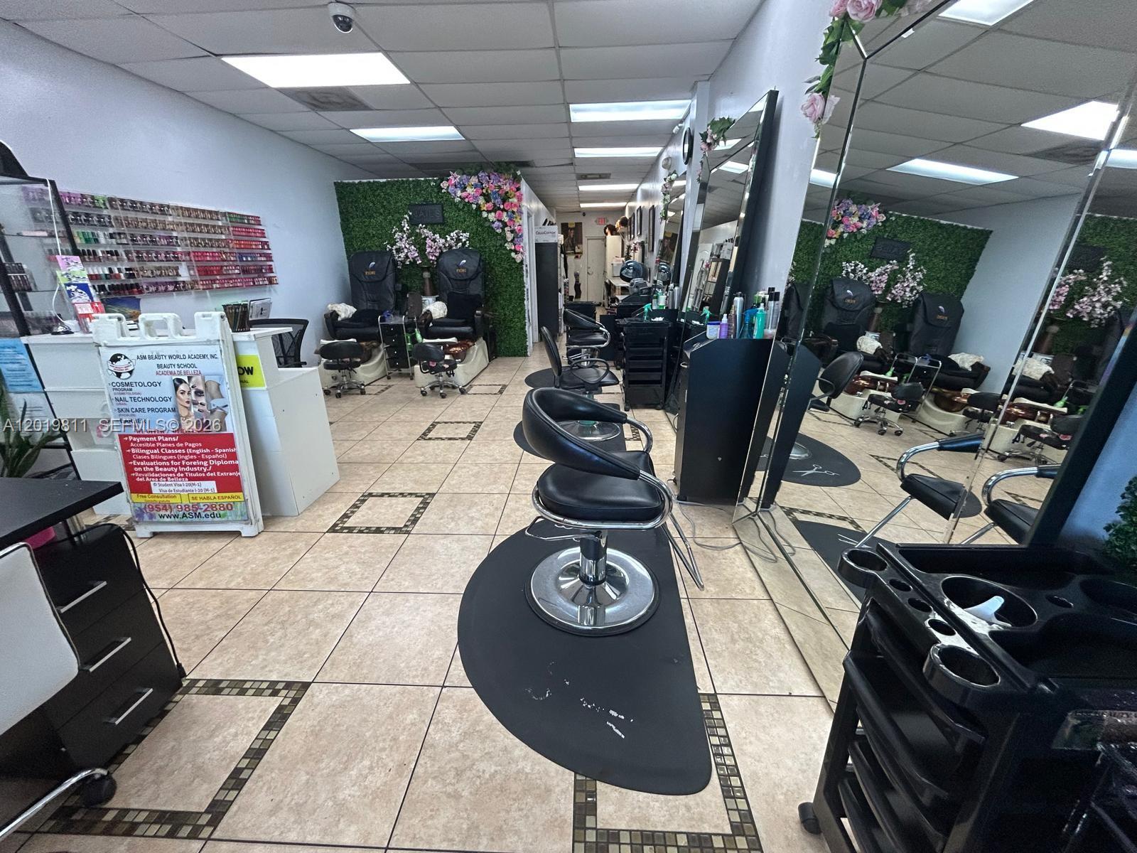 A beauty salon interior features styling chairs, pedicure stations, mirrors, and tiled flooring — 6630 Stirling Rd, Davie FL 33024, DAVIE, FL