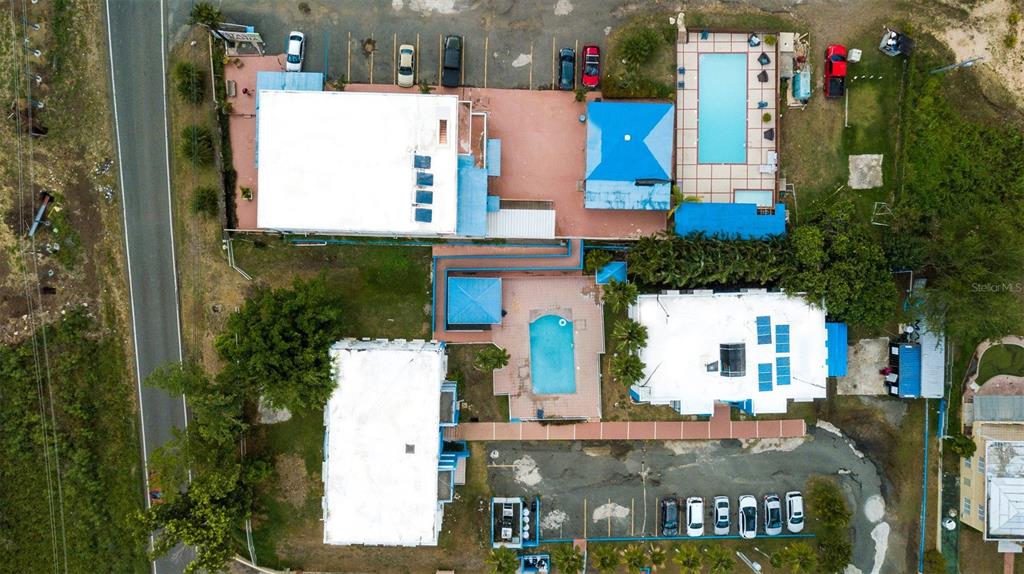 Aerial view of a resort property featuring two swimming pools and multiple parking areas — ST 307 KM 7.4, BOQUERON, PR