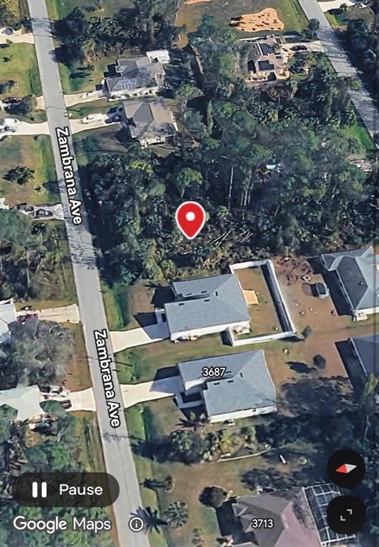 This is an aerial map view showing a residential street with houses and a vacant lot — ZAMBRANA AVENUE, NORTH PORT, FL