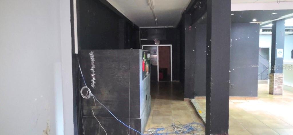 An interior view of a commercial space featuring black walls, tiled floors, and exposed wiring — William AVE BORINQUEN ESQ, BO OBRERO, PR