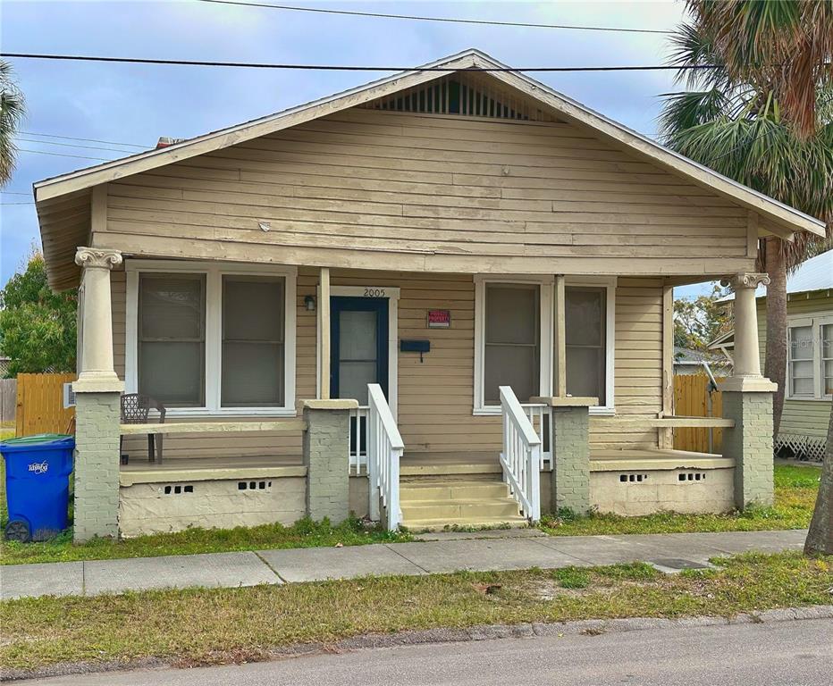 A single-story house with tan siding, a front porch, and two decorative columns — 2005 N 25TH STREET, TAMPA, FL