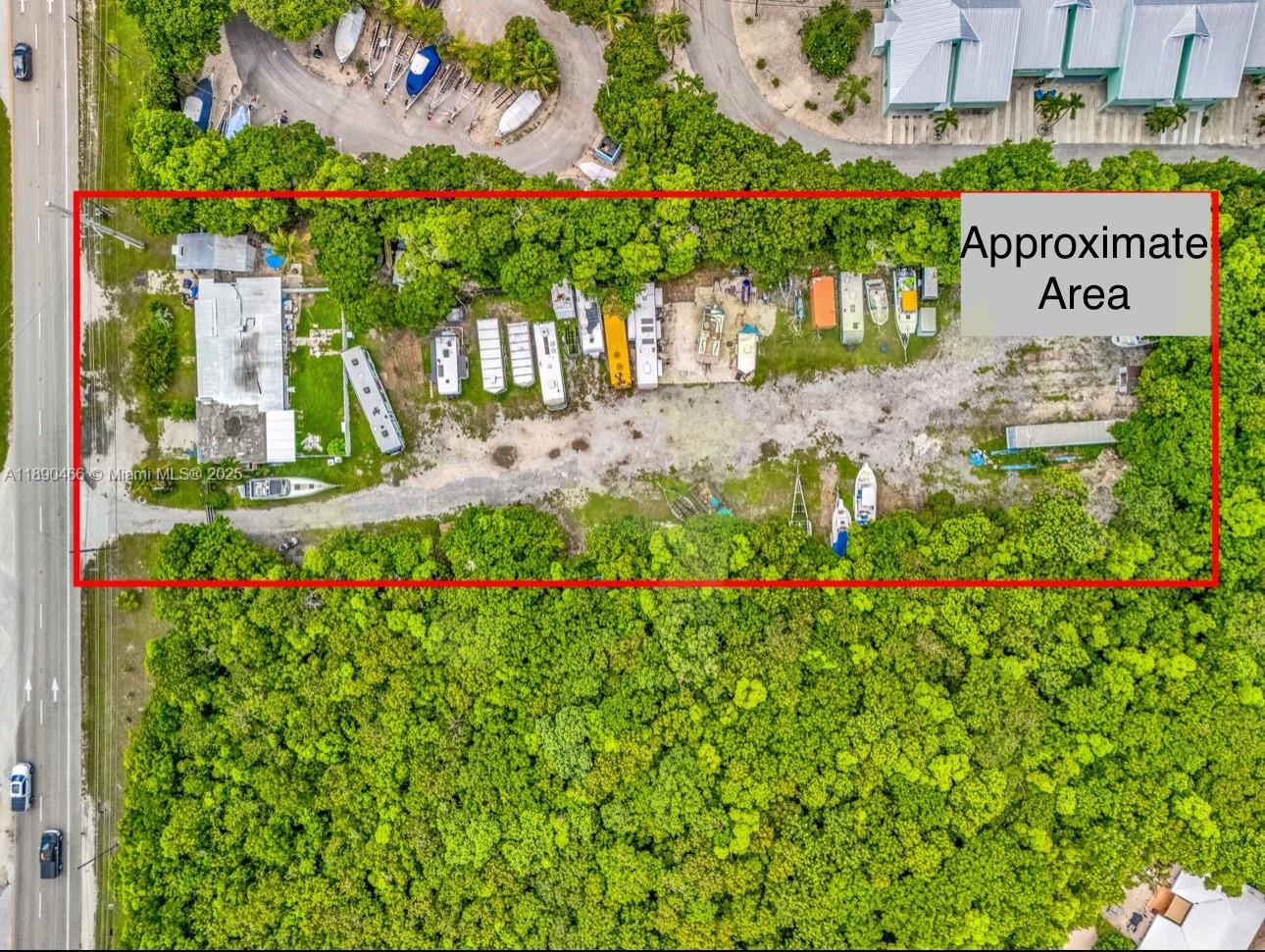 An aerial view shows a rectangular lot containing a building, several trailers, and boats — 98468 Overseas Hwy, Key Largo FL 33037, KEY LARGO, FL
