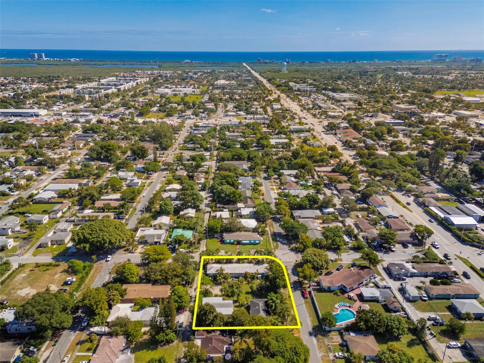 An aerial view shows a residential lot outlined in yellow within a suburban neighborhood — 302 SW 15th Street, Dania Beach FL 33004, DANIA BEACH, FL