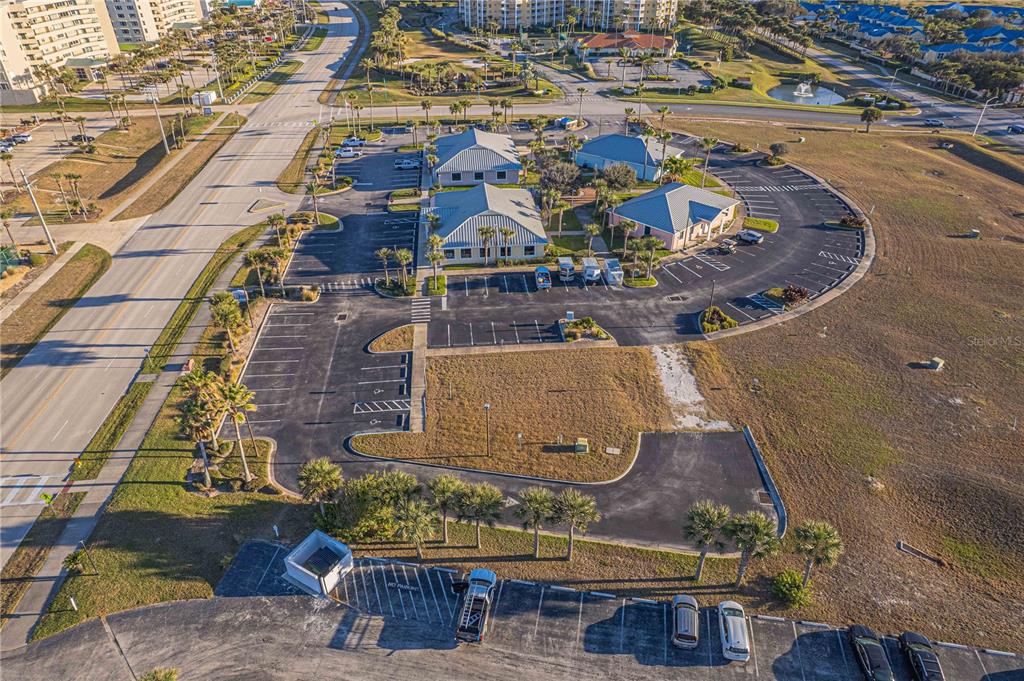 An aerial view shows a commercial office complex with parking lots and surrounding landscaping — 4598 S ATLANTIC AVENUE, PORT ORANGE, FL