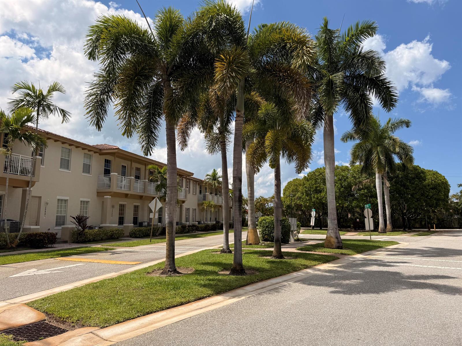 A row of palm trees stands along a grassy median in front of a residential building — 2512 NW 4th Street, Boynton Beach FL 33426, BOYNTON BEACH, FL