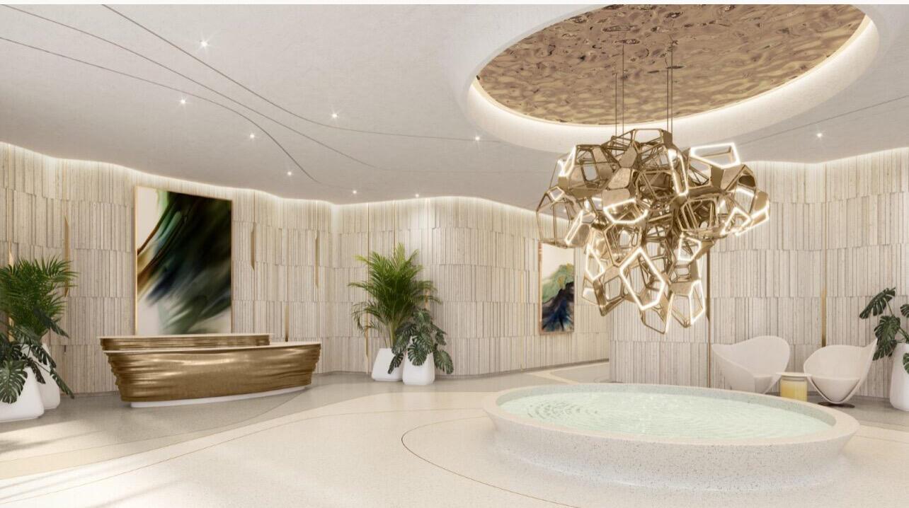 This rendering shows a modern lobby with a gold reception desk, chandelier, and circular fountain — 521 E Las Olas Boulevard, Fort Lauderdale FL 33301, FORT LAUDERDALE, FL
