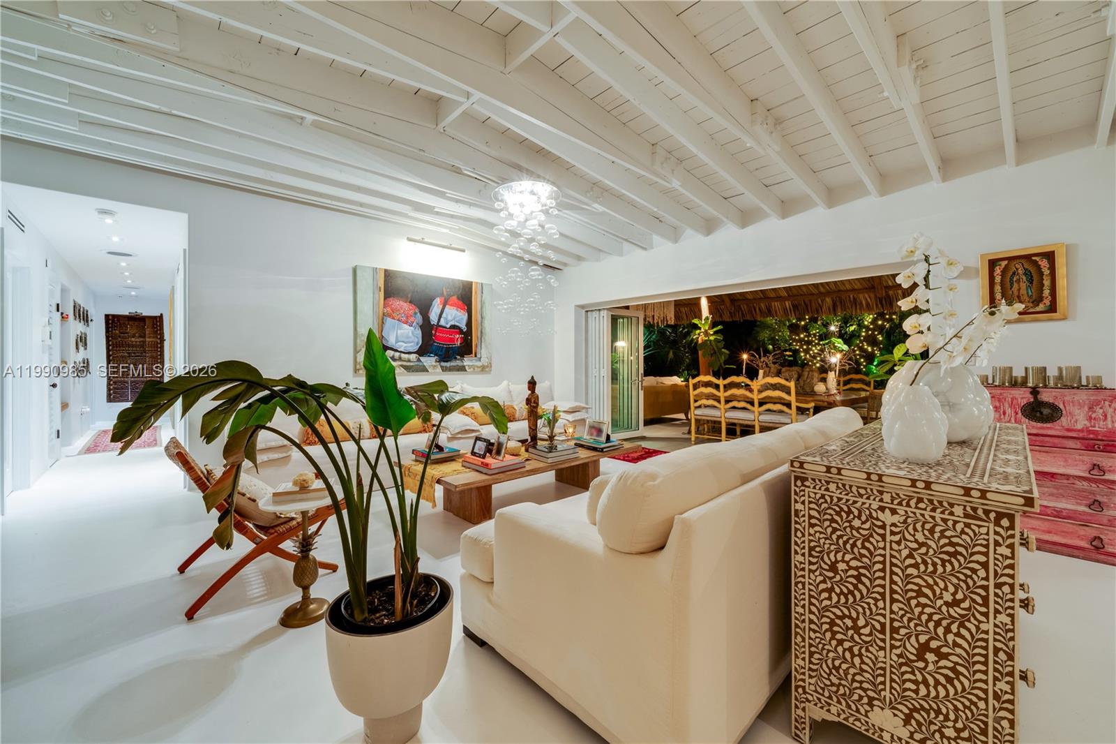 A bright living room features a white vaulted ceiling, white floors, and an open patio — 330 Gulf Rd, Key Biscayne FL 33149, KEY BISCAYNE, FL