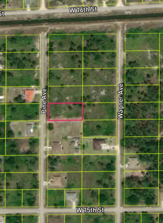 This is an aerial map showing a vacant rectangular lot highlighted in pink — 1510 PINE AVENUE, LEHIGH ACRES, FL