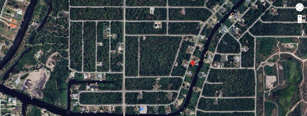 This is an aerial map view of a residential neighborhood with streets and a canal — 1380 EPPINGER DRIVE, PORT CHARLOTTE, FL
