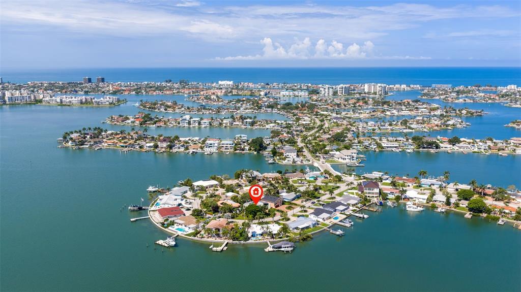 An aerial view shows a waterfront residential neighborhood with homes situated on small islands — 735 79TH CIRCLE S, ST PETERSBURG, FL