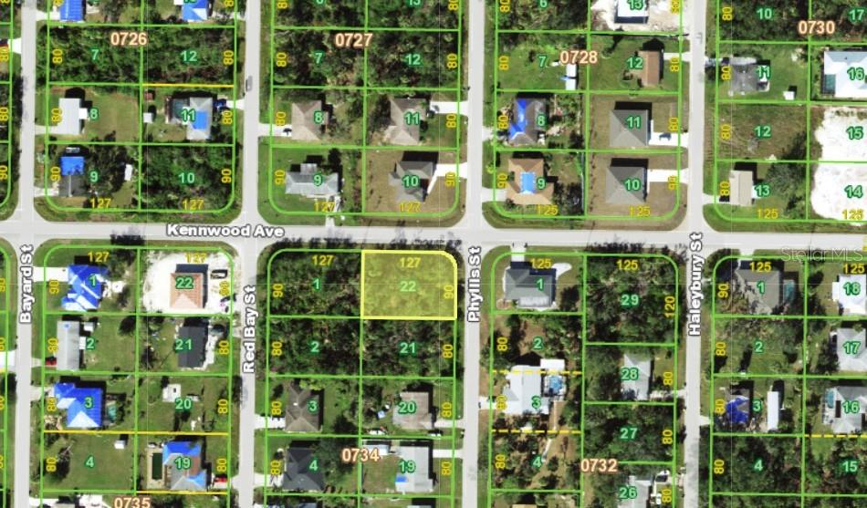 This is an aerial map showing a vacant residential lot highlighted in yellow — 1071 KENNWOOD AVENUE, PORT CHARLOTTE, FL