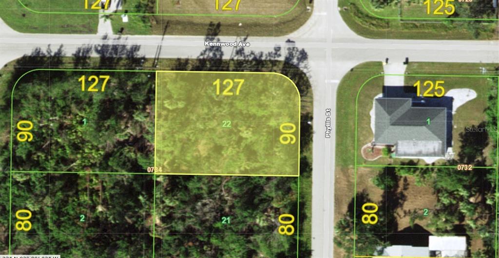 This is an aerial map showing a vacant residential lot highlighted in yellow — 1071 KENNWOOD AVENUE, PORT CHARLOTTE, FL