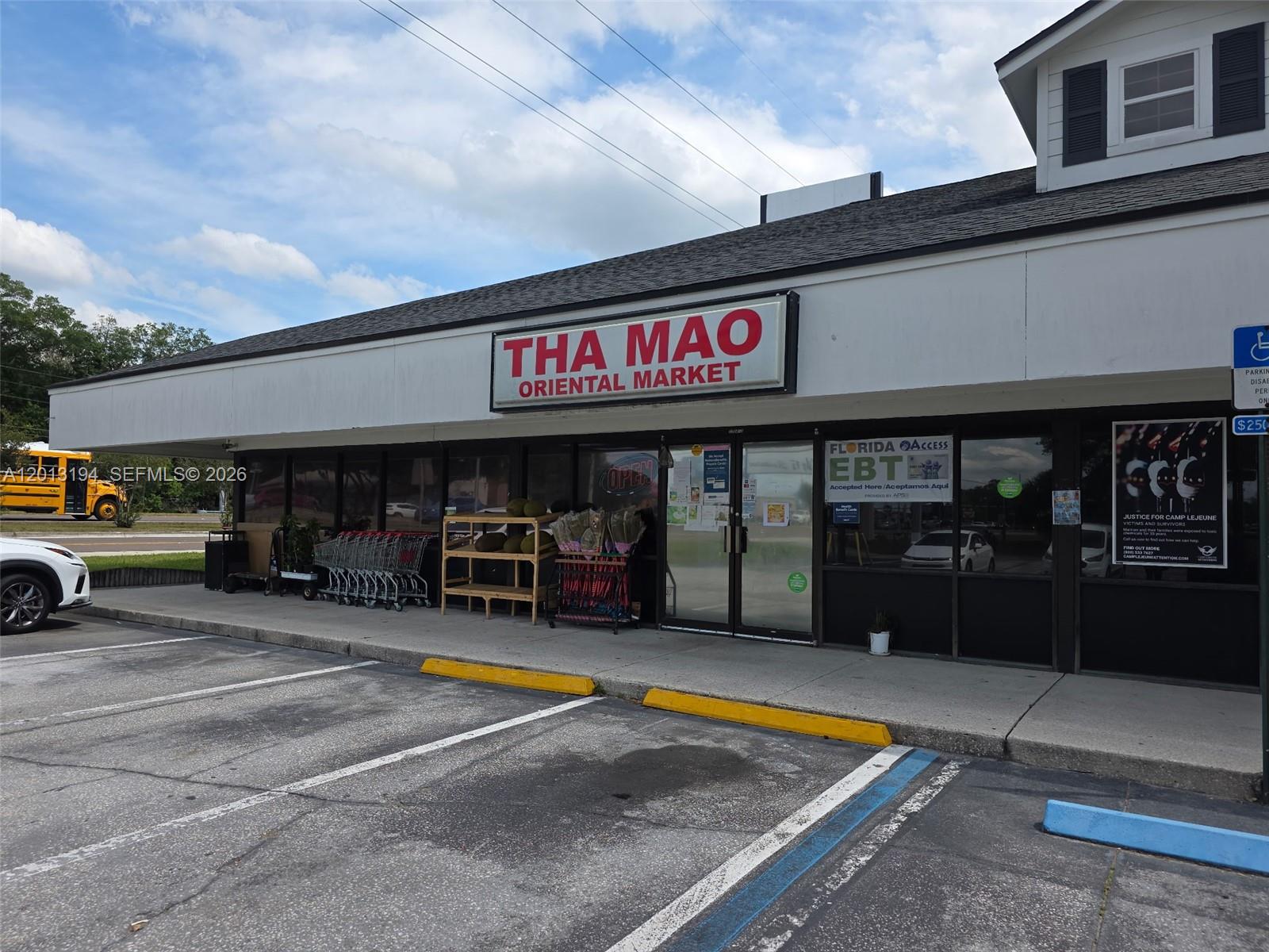 The exterior of a commercial building features a sign for Tha Mao Oriental Market — 1704 S SOUTHSIDE BLVD, Jacksonville FL 32216, JACKSONVILLE, FL