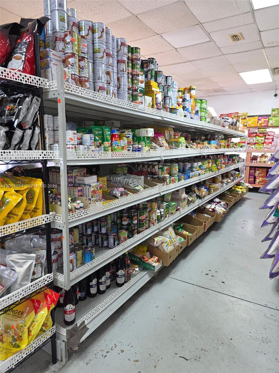 A retail store aisle features metal shelving units stocked with various canned goods and packaged products — 1704 S SOUTHSIDE BLVD, Jacksonville FL 32216, JACKSONVILLE, FL