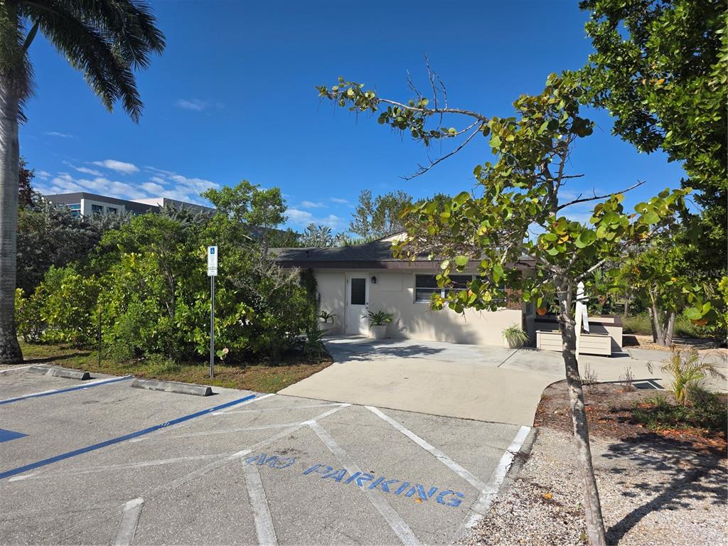 A single-story building with a concrete driveway and a marked no-parking zone in front — 725 PATTY AVENUE, PUNTA GORDA, FL