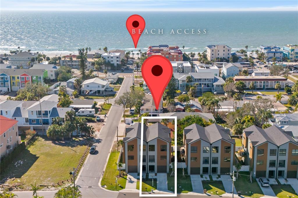 An aerial view shows a modern multi-story townhouse with a white rectangular outline — 2200 BAY BOULEVARD UNIT B, INDIAN ROCKS BEACH, FL