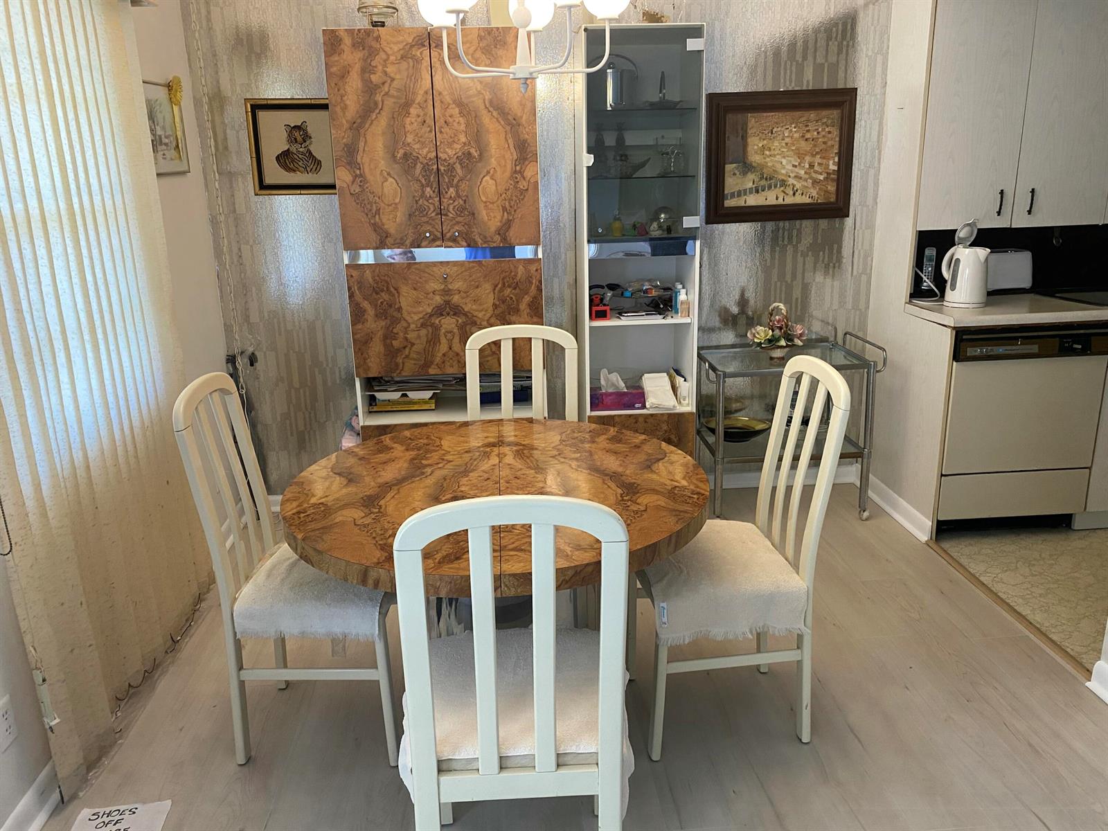 A dining area features a round burl wood table, matching cabinet, and four white chairs — 2054 Ainslie D, Boca Raton FL 33434, BOCA RATON, FL