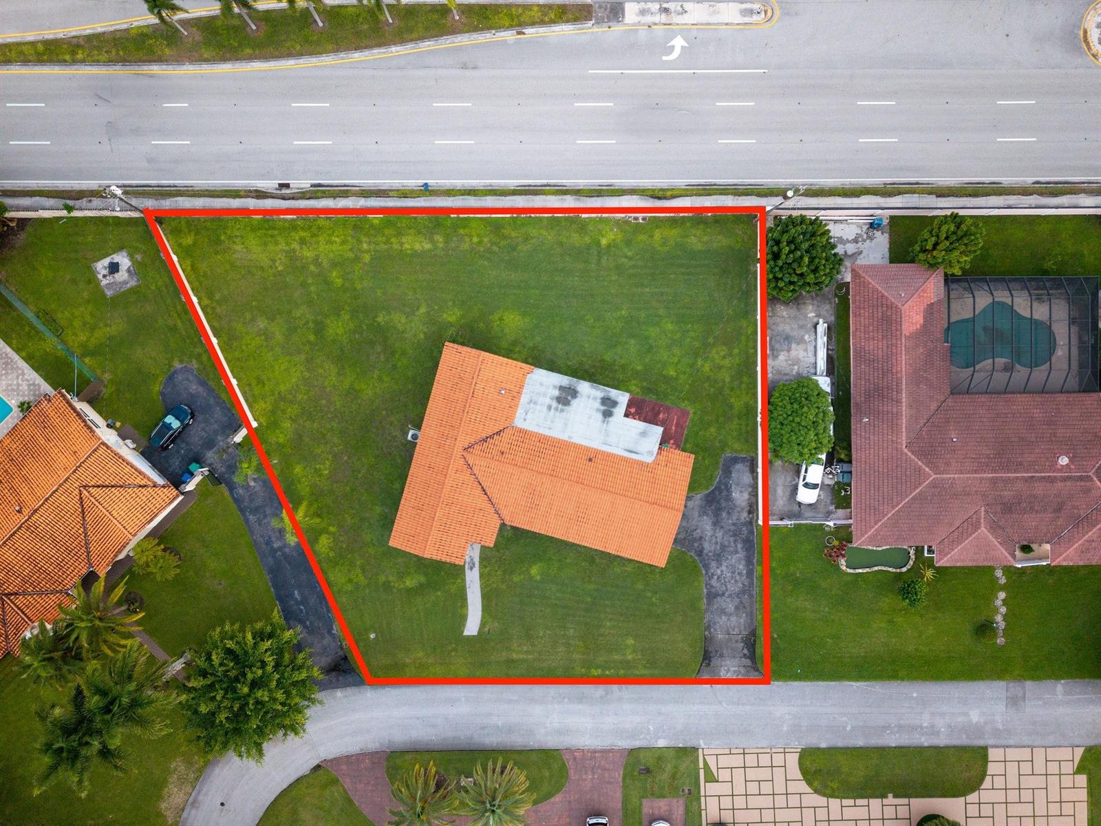 An aerial view shows a house with a red tile roof on a trapezoidal lot — 8230 SW 87th Terrace, Miami FL 33143, MIAMI, FL