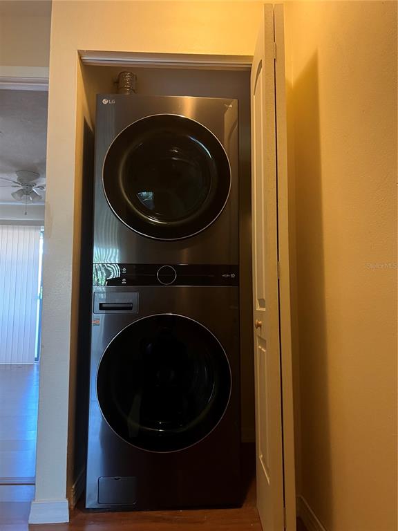 A stacked LG washer and dryer unit is installed inside a small closet — 1428 HIGHLAND RIDGE CIRCLE, BRANDON, FL