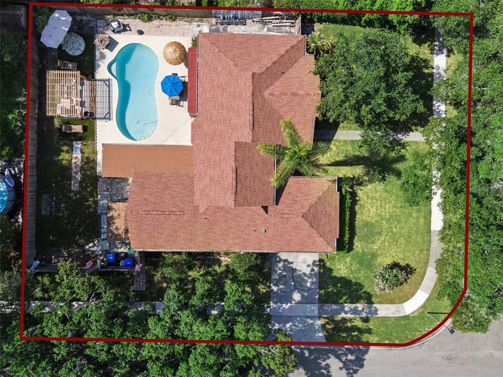 An aerial view shows a house with a red roof, a swimming pool, and landscaping — 5405 BAYBROOK AVENUE, ORLANDO, FL