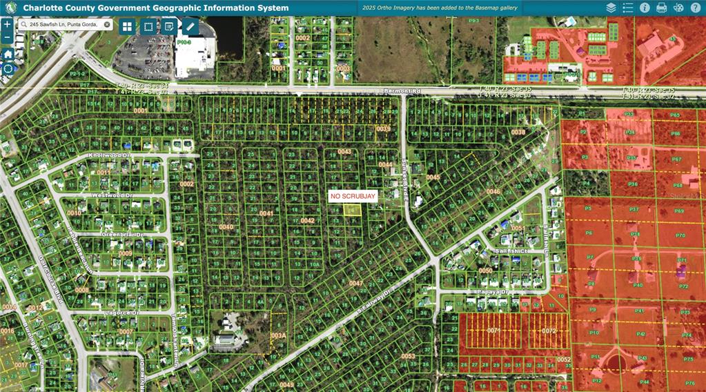 This is a digital map showing land parcels, street layouts, and zoning areas in Charlotte County — 245 SAWFISH LANE, PUNTA GORDA, FL