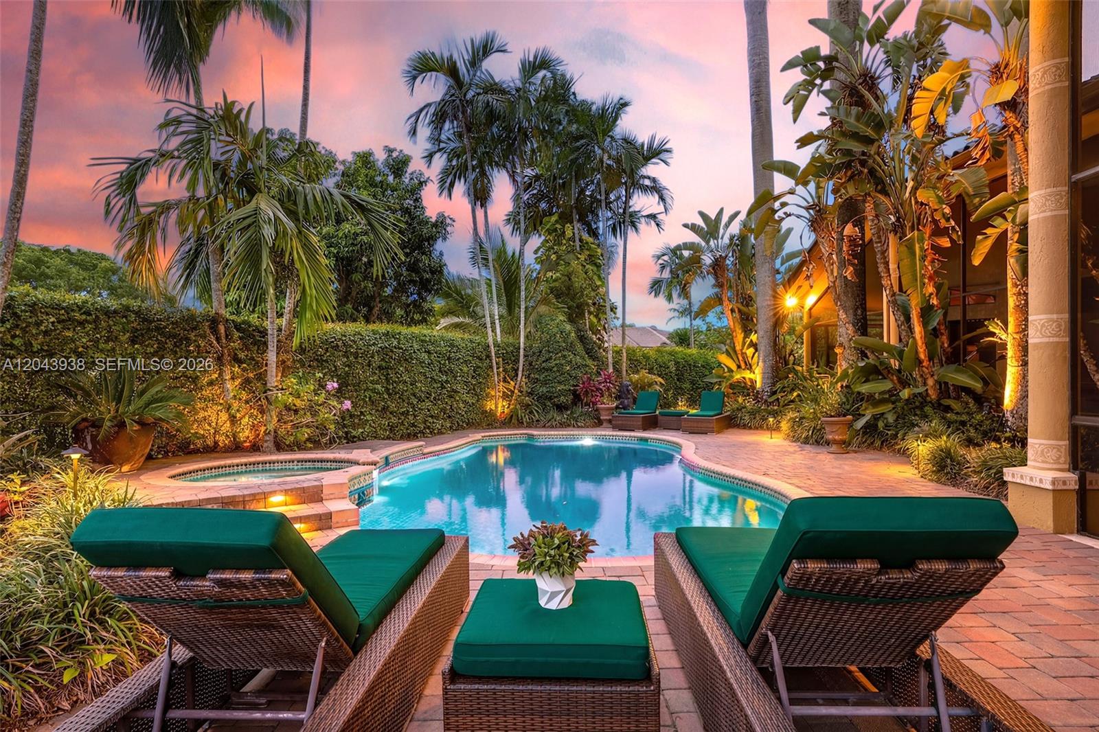 A backyard swimming pool and hot tub surrounded by lounge chairs and tropical landscaping — 29482 SW 193rd Ct, Homestead FL 33030, HOMESTEAD, FL
