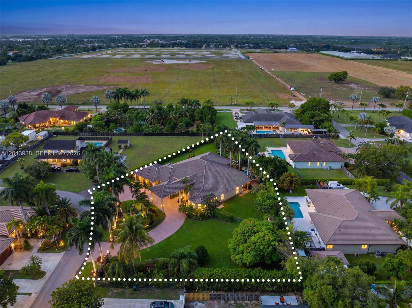 An aerial view shows a large suburban house with a pool and landscaped yard — 29482 SW 193rd Ct, Homestead FL 33030, HOMESTEAD, FL