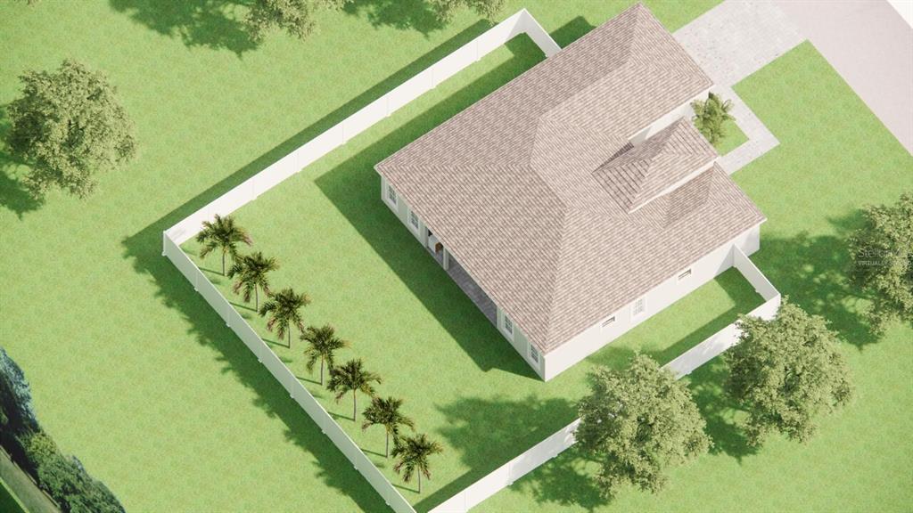 A modern white single-story house with a black garage door and a paved driveway — 1400 MENDAVIA TERRACE, NORTH PORT, FL