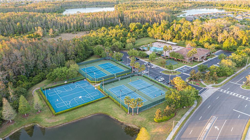 An aerial view shows a community recreation area with tennis courts, a basketball court, and pool — 14921 BRAYWOOD TRAIL, ORLANDO, FL