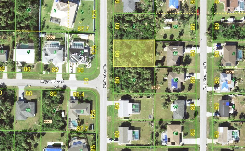 This is an aerial map showing residential lots and streets in a suburban neighborhood — 18124 WOLBRETTE CIRCLE, PORT CHARLOTTE, FL