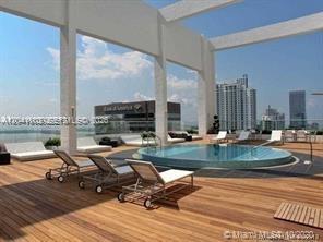 This rendering shows a rooftop deck with a circular pool and lounge chairs — 500 Brickell Ave # 2604, Miami FL 33131, MIAMI, FL
